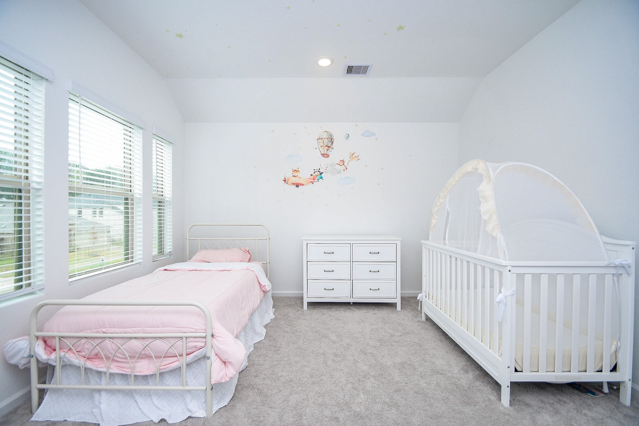 28722 Mount Bonnell Drive New Caney, TX 77357 - Photo 25 of 32 a spacious bedroom with a bed and a window