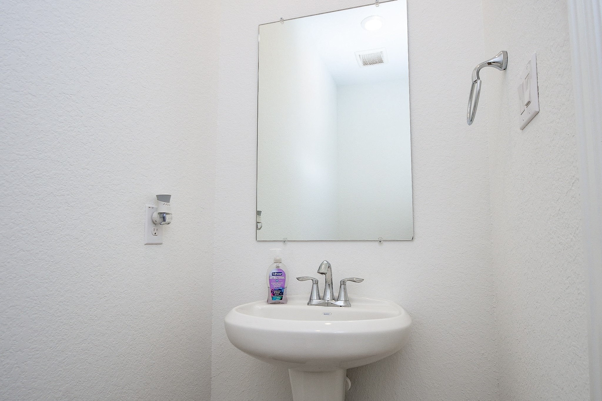 28722 Mount Bonnell Drive New Caney, TX 77357 - Photo 30 of 32 a bathroom with a sink a mirror and a toilet