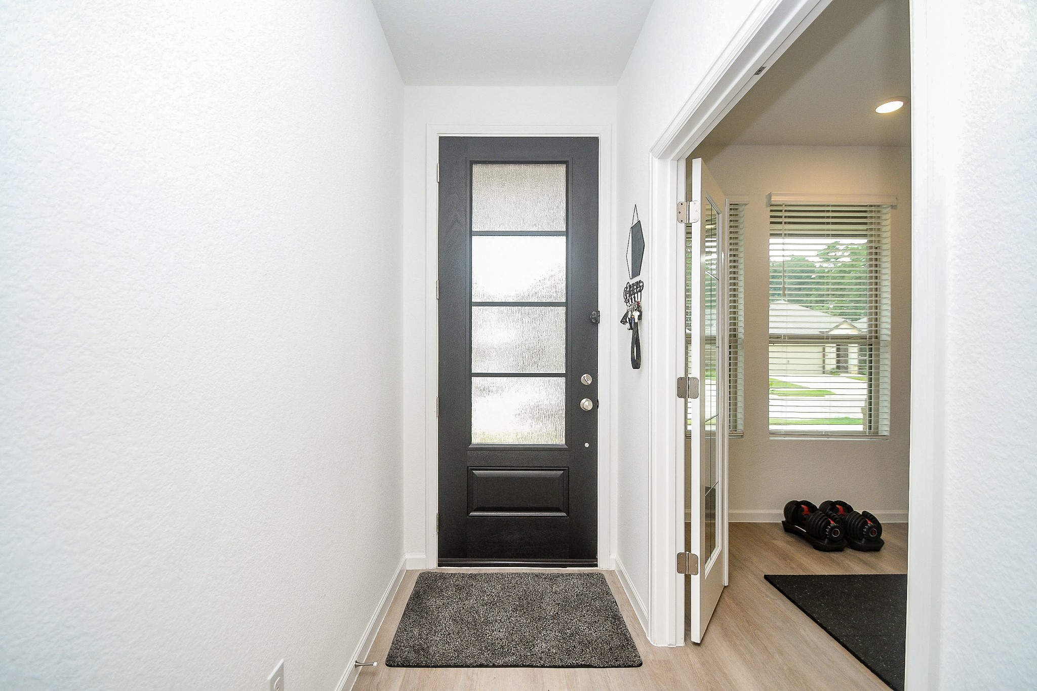 28722 Mount Bonnell Drive New Caney, TX 77357 - Photo 3 of 32 a view of walk in closet with window and entryway