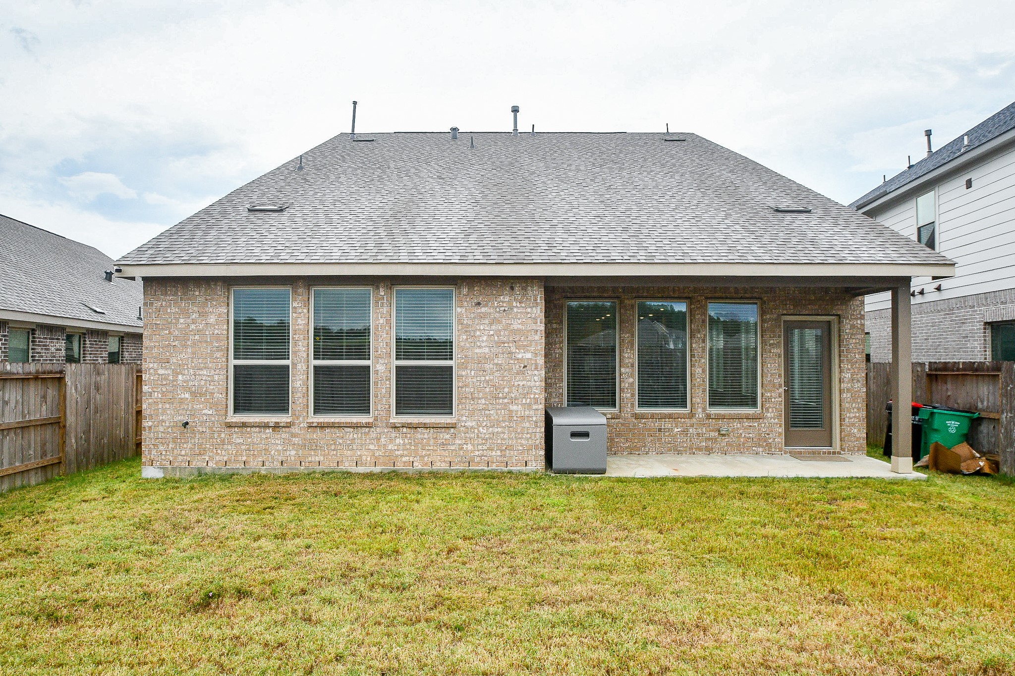 28722 Mount Bonnell Drive New Caney, TX 77357 - Photo 32 of 32 a front view of a house with a yard