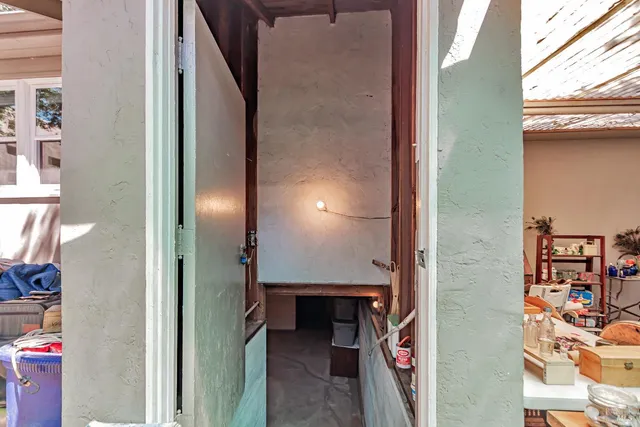 a view of a yard with wooden fence