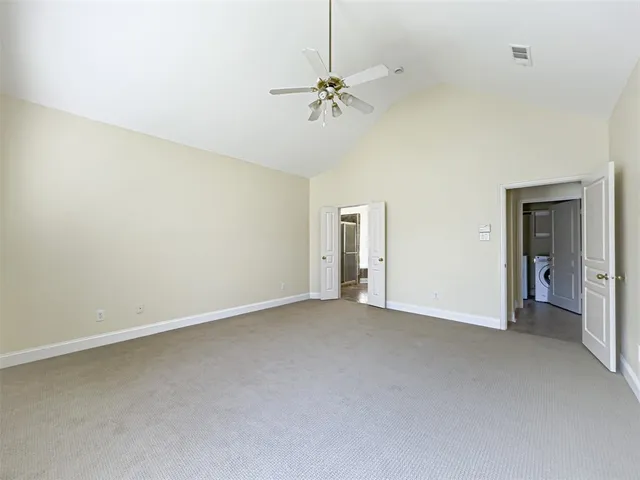 a spacious bathroom with a shower and a sink