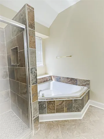 a bath tub sitting next to a window