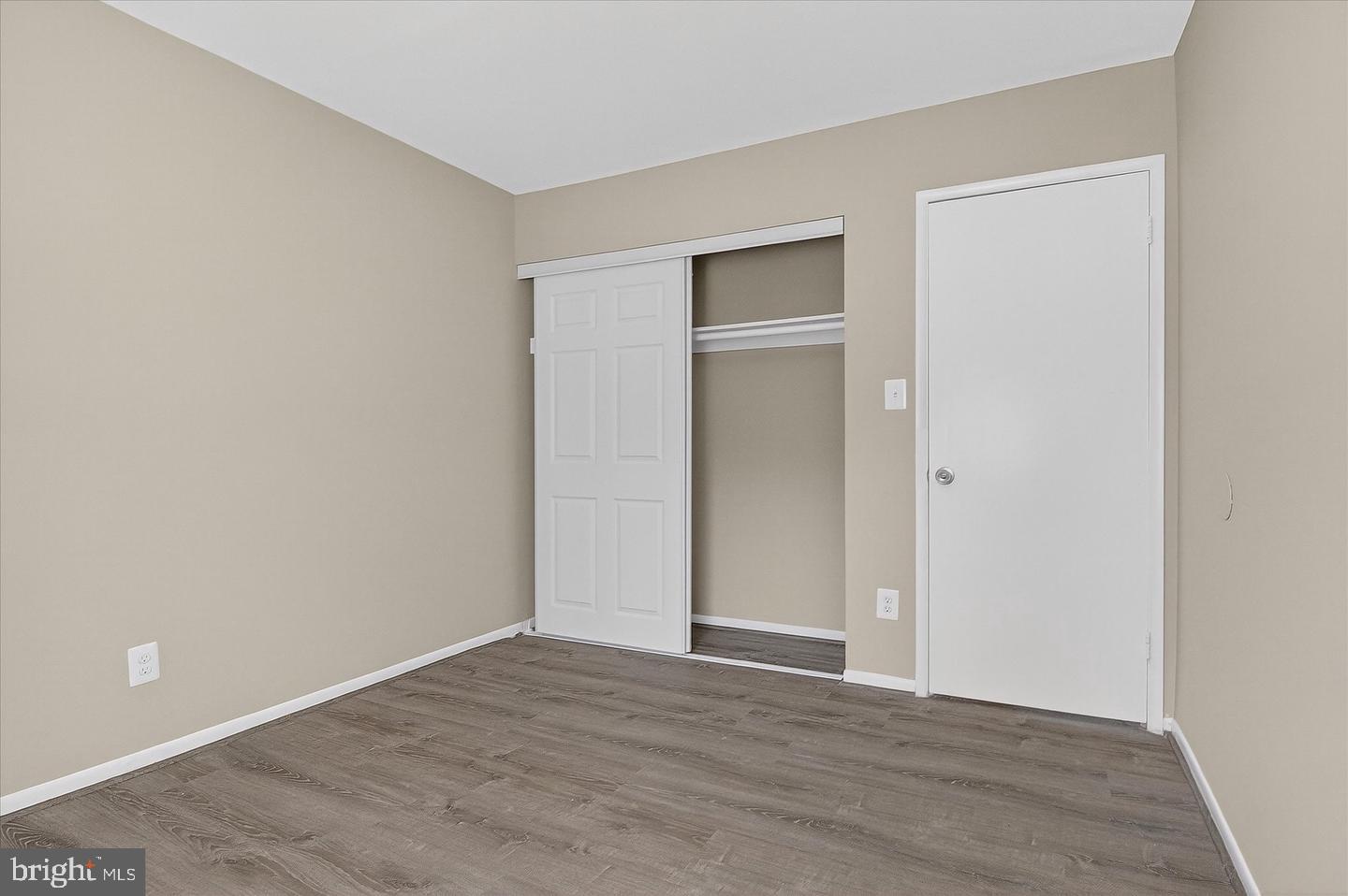 402 Reneau Way Herndon, VA 20170 - Photo 19 of 23 a view of an empty room with wooden floor and closet