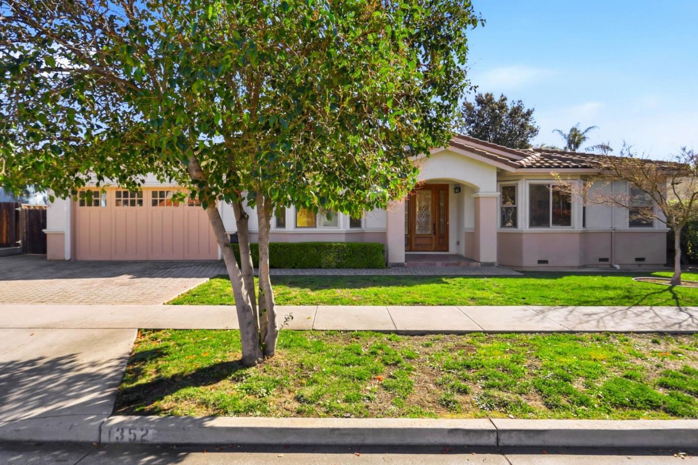 1352 South Stelling Road Cupertino, CA 95014 - Photo 2 of 49 a front view of a house with garden