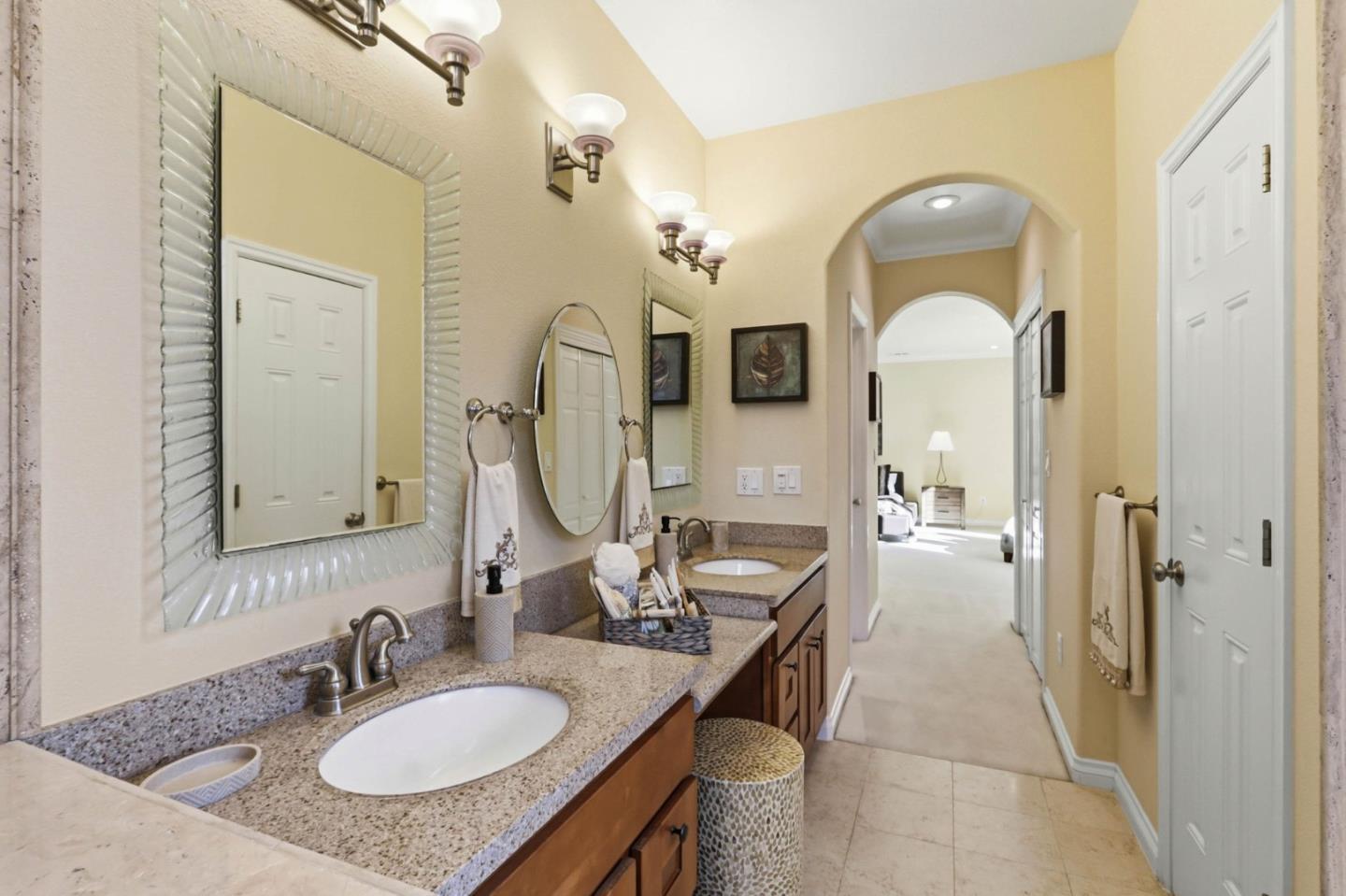 1352 South Stelling Road Cupertino, CA 95014 - Photo 27 of 49 a en suite bathroom with a granite countertop sink a mirror and shower