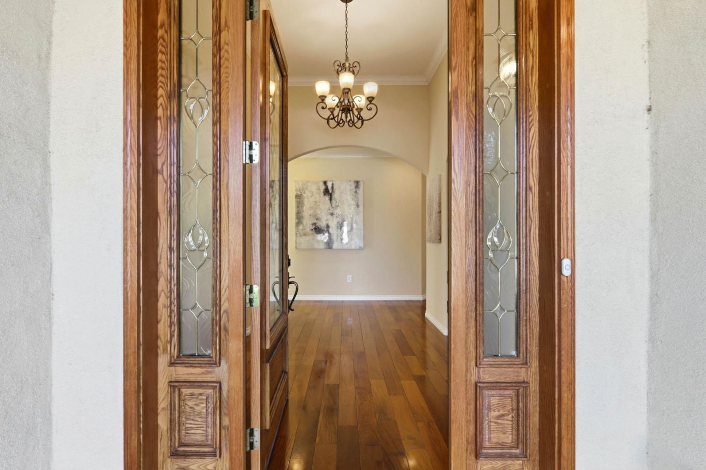 1352 South Stelling Road Cupertino, CA 95014 - Photo 6 of 49 a view of a hallway with windows and chandelier
