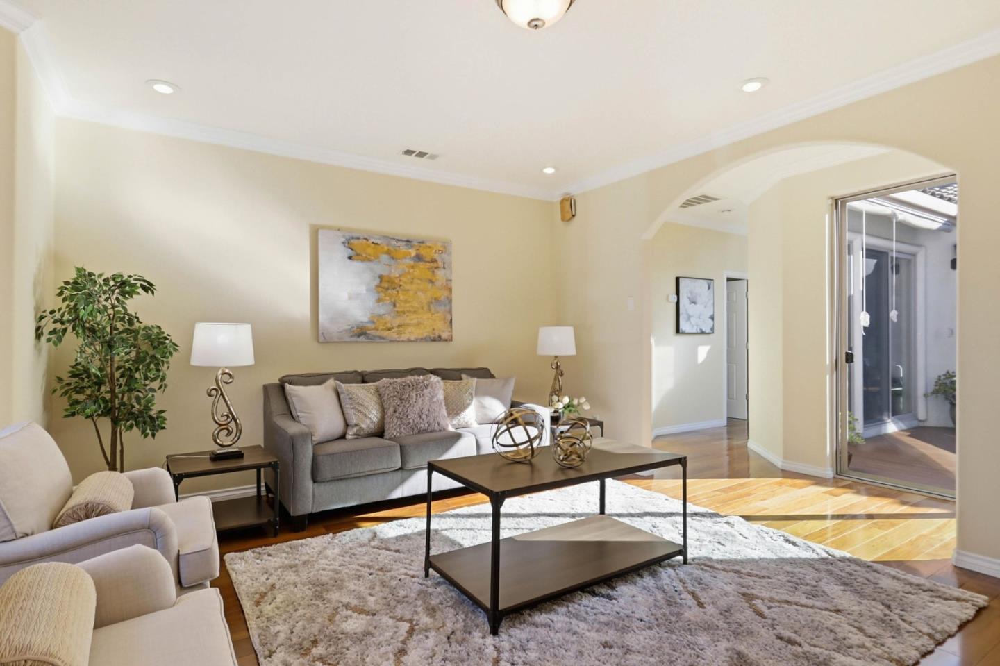 1352 South Stelling Road Cupertino, CA 95014 - Photo 10 of 49 a living room with furniture and a potted plant