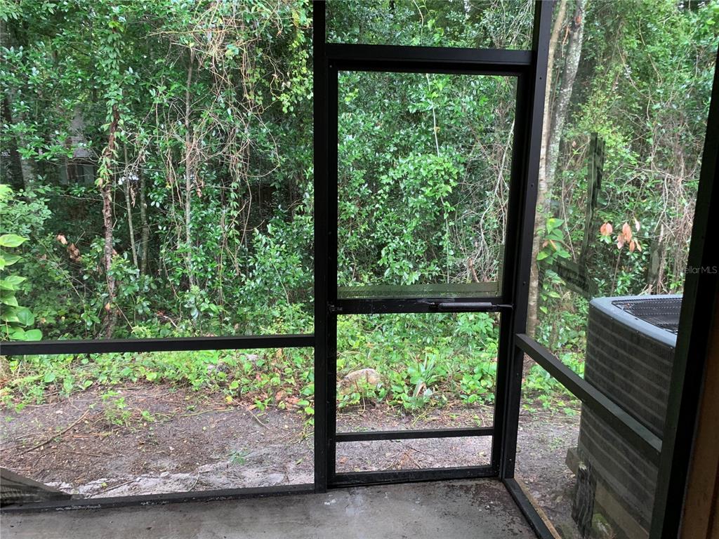 5754 Southwest 8th Place Gainesville, FL 32607 - Photo 24 of 29 a view of a yard with porch