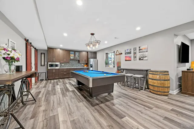 a kitchen with stainless steel appliances granite countertop a sink and a stove