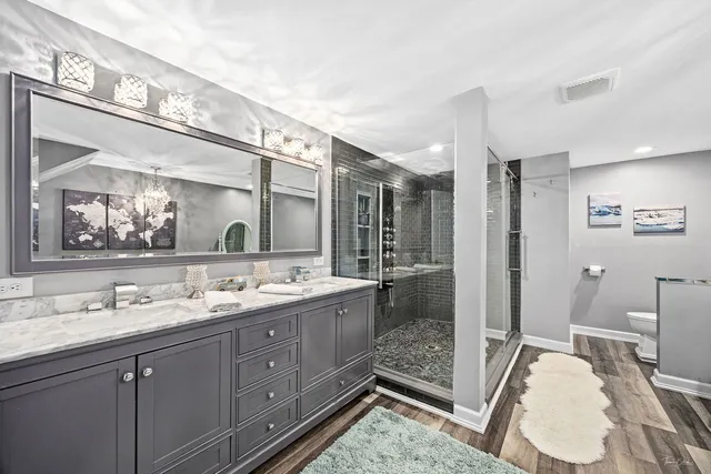 a view of walk in closet with clothes