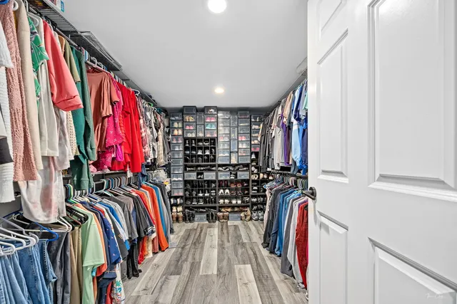 a large kitchen with a table and chairs
