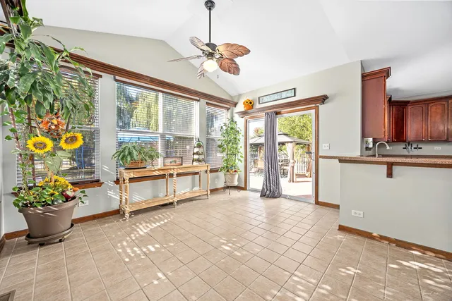 a kitchen with kitchen island granite countertop a stove oven and sink