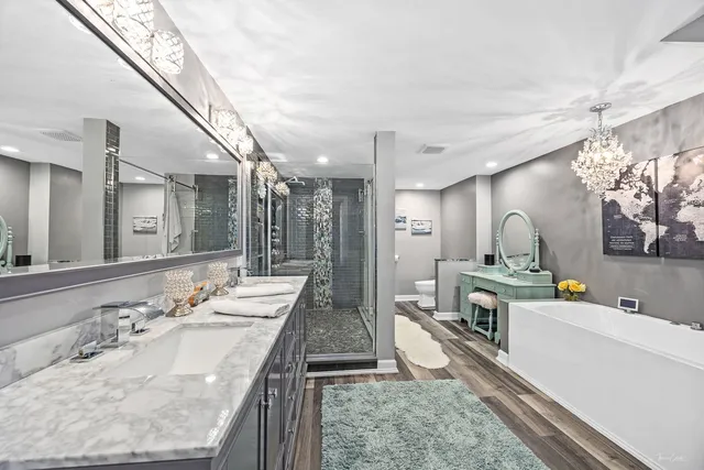 a bathroom with a double vanity sink and a mirror