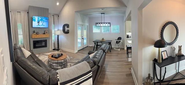 a view of a dining room and kitchen with a table chairs
