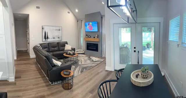 a living room with furniture and a fireplace