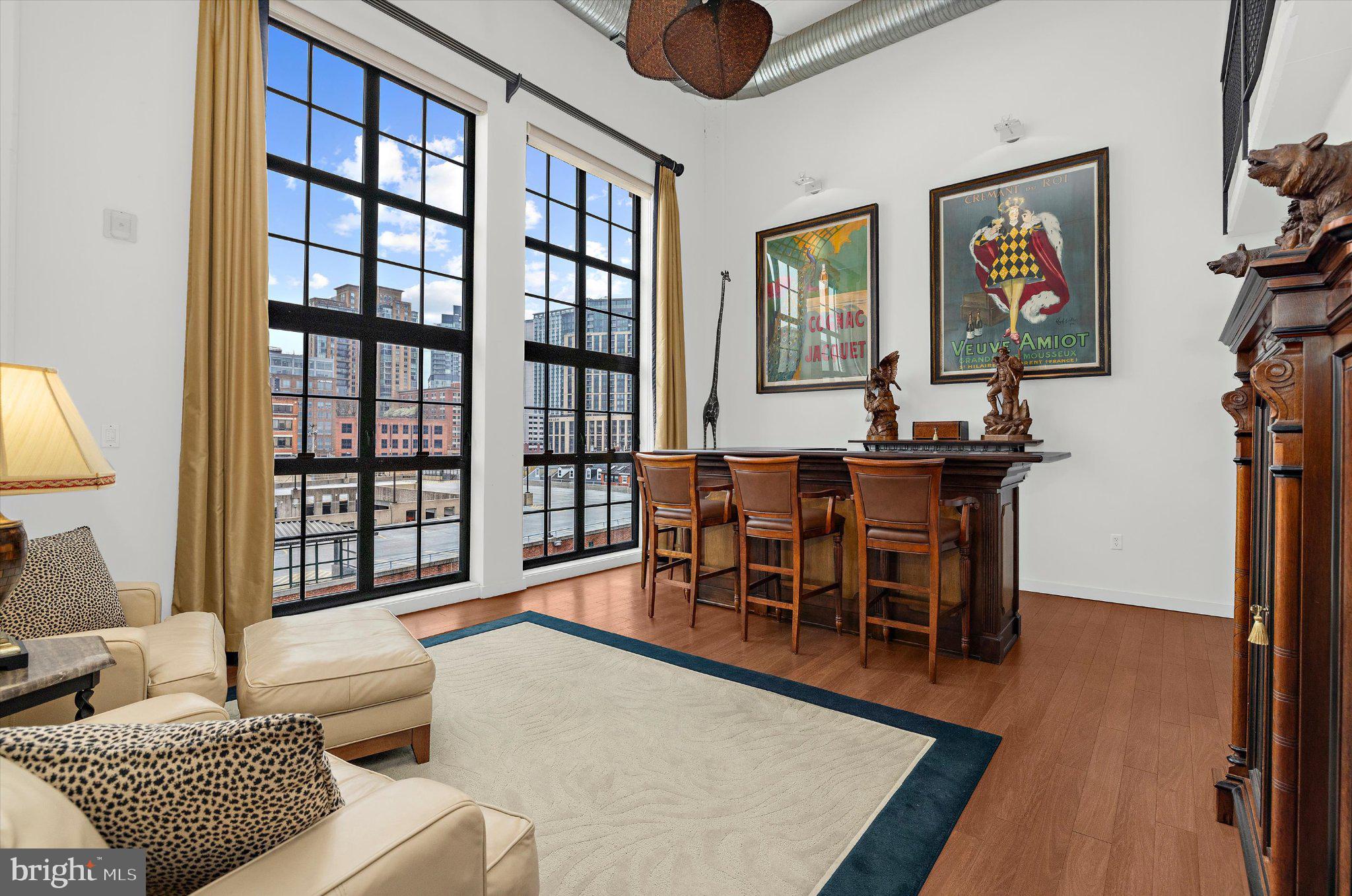 1220 Bank Street, Unit 409 Baltimore, MD 21202 - Photo 21 of 53 a living room with furniture and a window