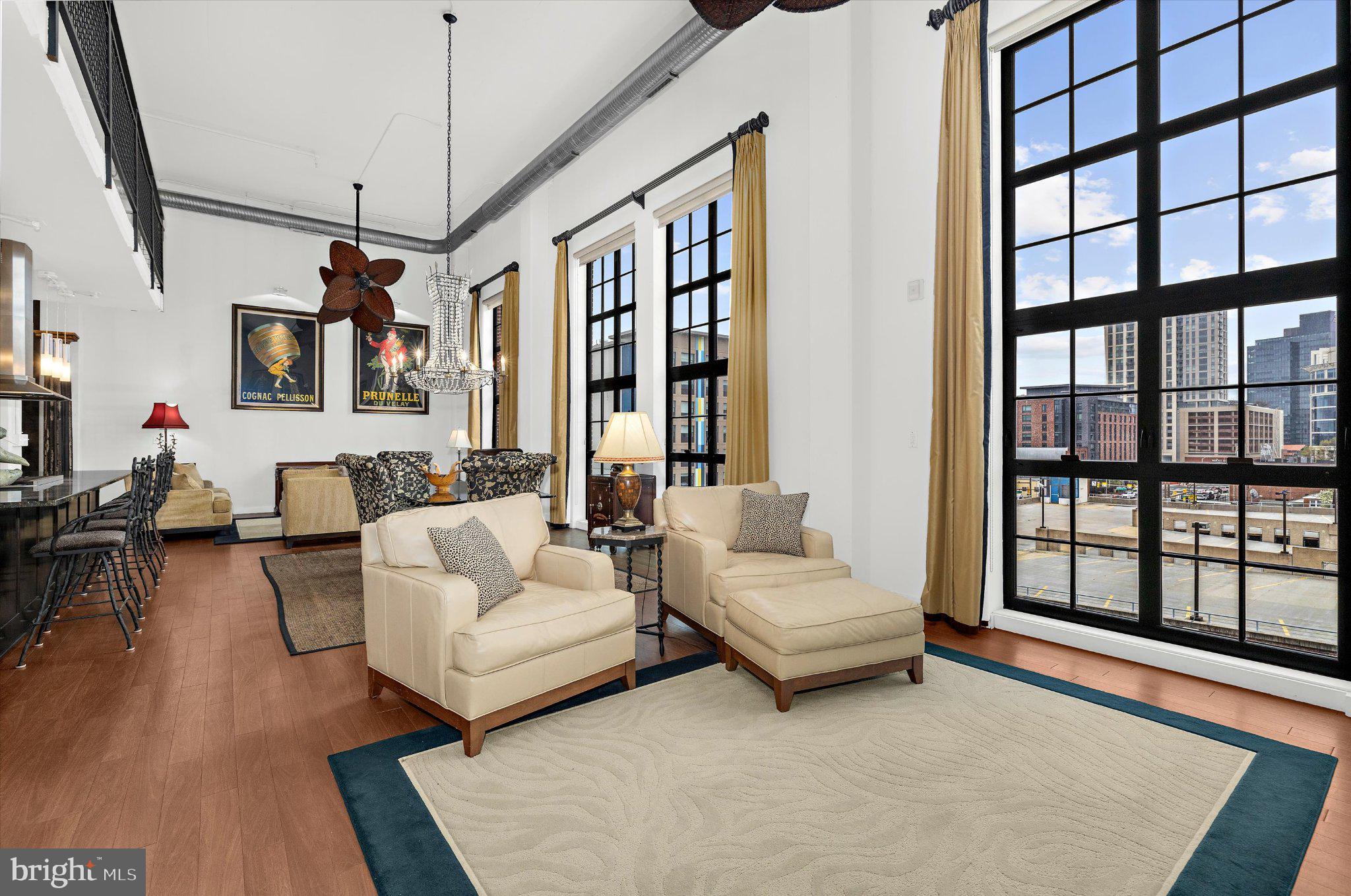 1220 Bank Street, Unit 409 Baltimore, MD 21202 - Photo 22 of 53 a living room with furniture and a large window