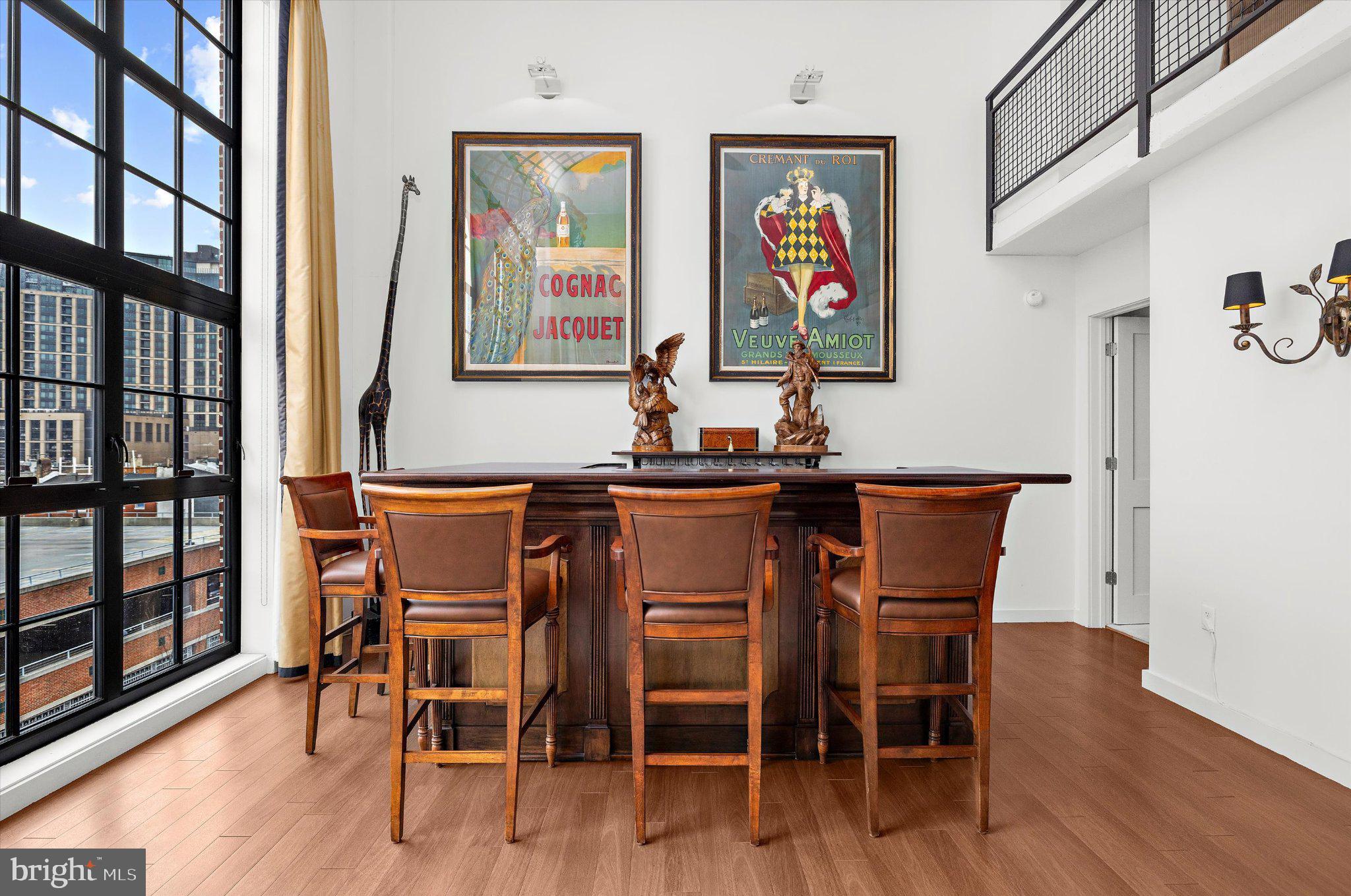 1220 Bank Street, Unit 409 Baltimore, MD 21202 - Photo 24 of 53 a dining room with furniture and wooden floor