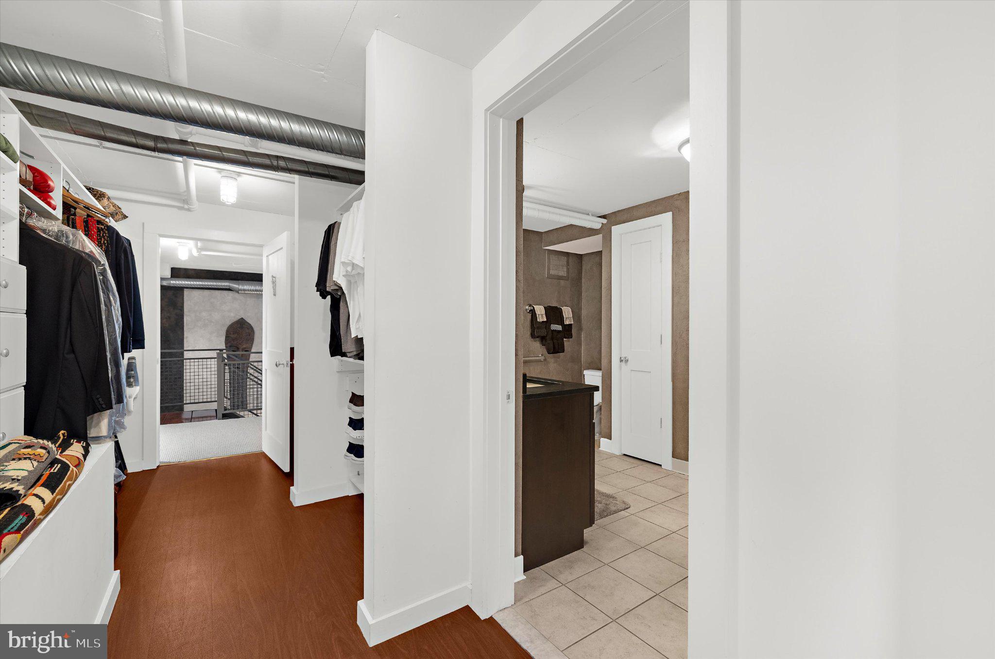 1220 Bank Street, Unit 409 Baltimore, MD 21202 - Photo 39 of 53 a view of a hallway with closet and a living room