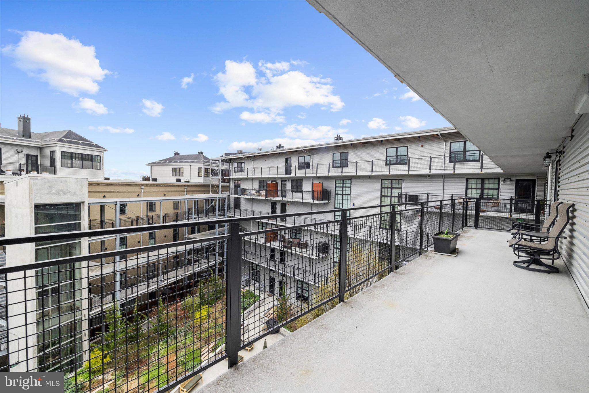 1220 Bank Street, Unit 409 Baltimore, MD 21202 - Photo 46 of 53 a view of a balcony with city view
