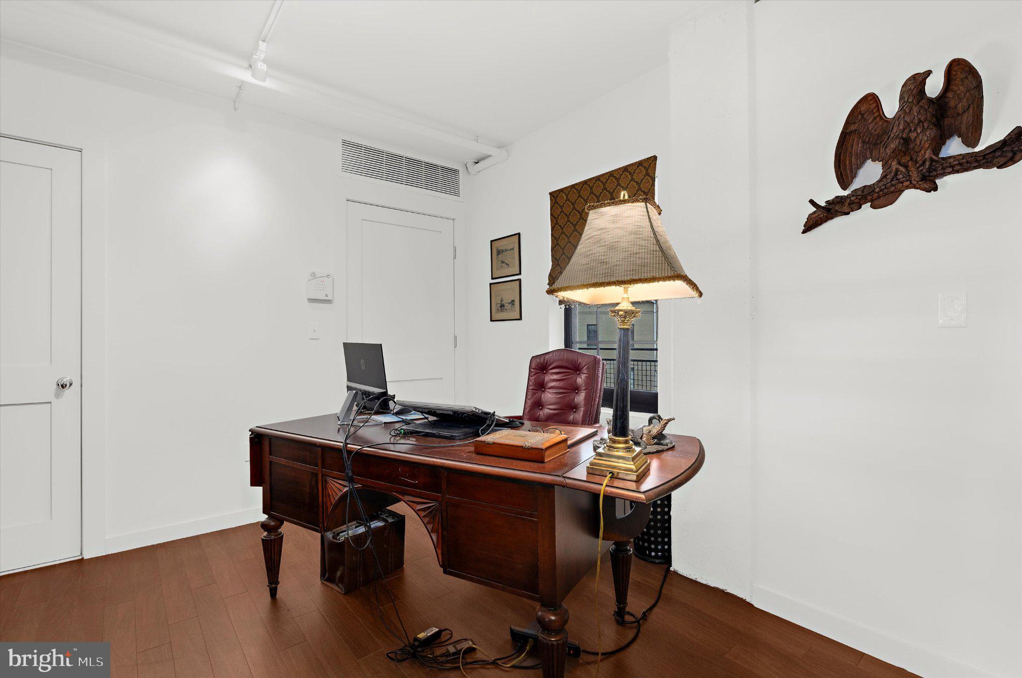 1220 Bank Street, Unit 409 Baltimore, MD 21202 - Photo 8 of 53 a work room with furniture and wooden floor