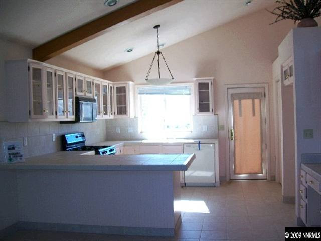 10810 Santa Fe Road Reno, NV 89508 - Photo 3 of 9 a room with pool table and windows