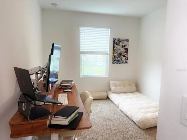 a living room with furniture and a window