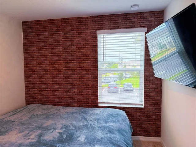 a view of an empty room and a window