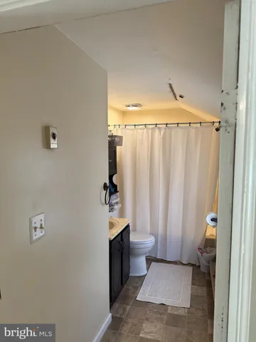 a bathroom with a shower and a tub
