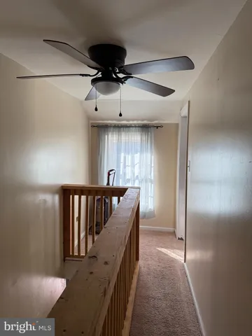 a view of entryway and hall with a dining table