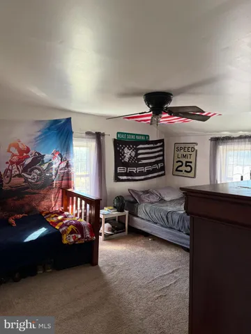 a bedroom with furniture and a window