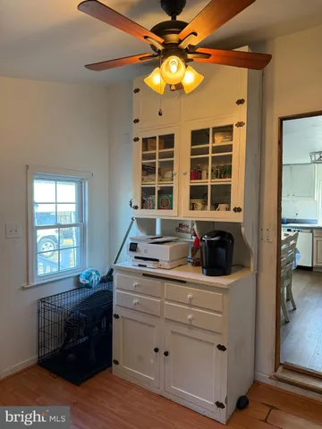 a kitchen with a stove a sink and a window