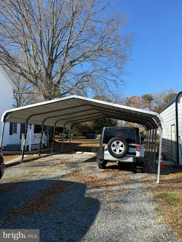 a view of a car parked in front of a house