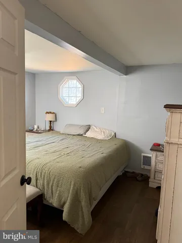 a bedroom with a bed and a table