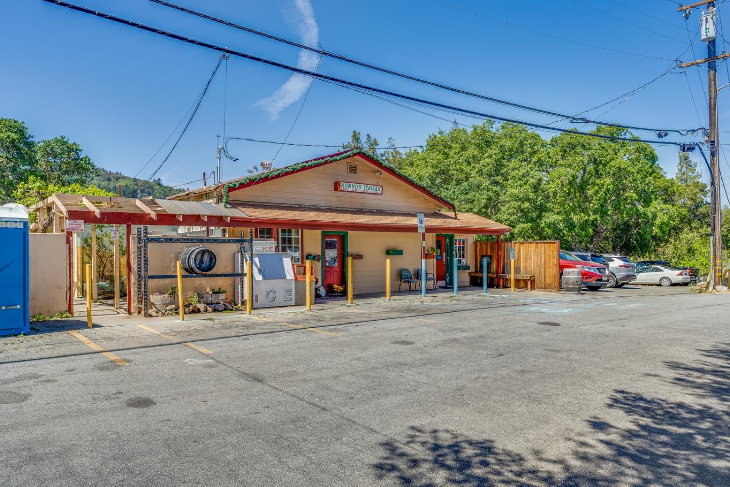 a front view of a house with basket ball court and a garage