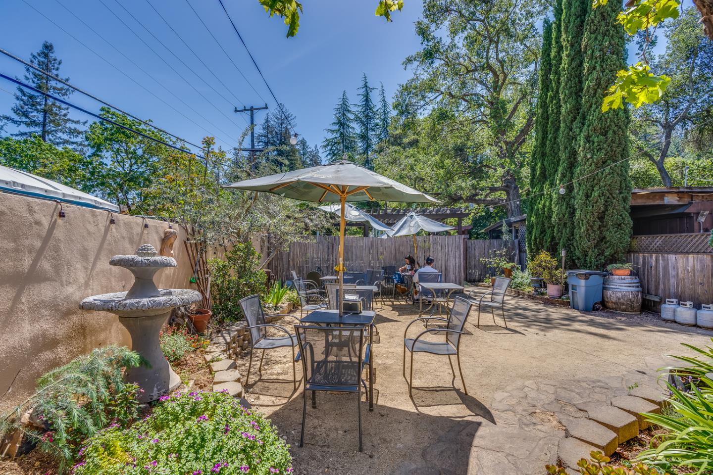 21433 Broadway Road Los Gatos, CA 95033 - Photo 5 of 41 an outdoor space with patio and white umbrellas