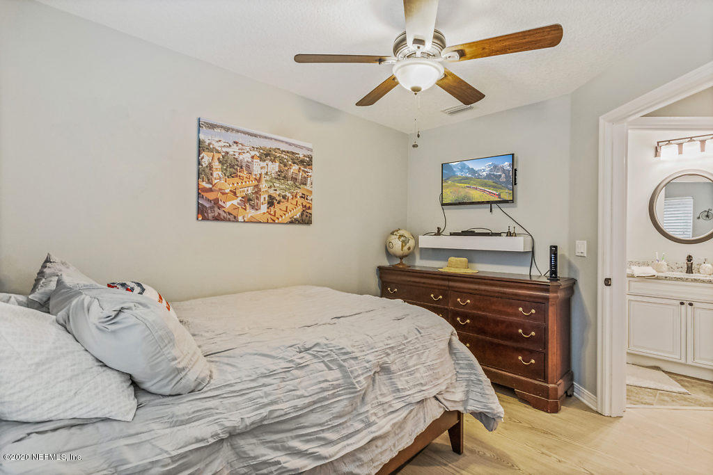 405 2nd Street St. Augustine, FL 32084 - Photo 15 of 49 a bedroom with a bed and a dresser