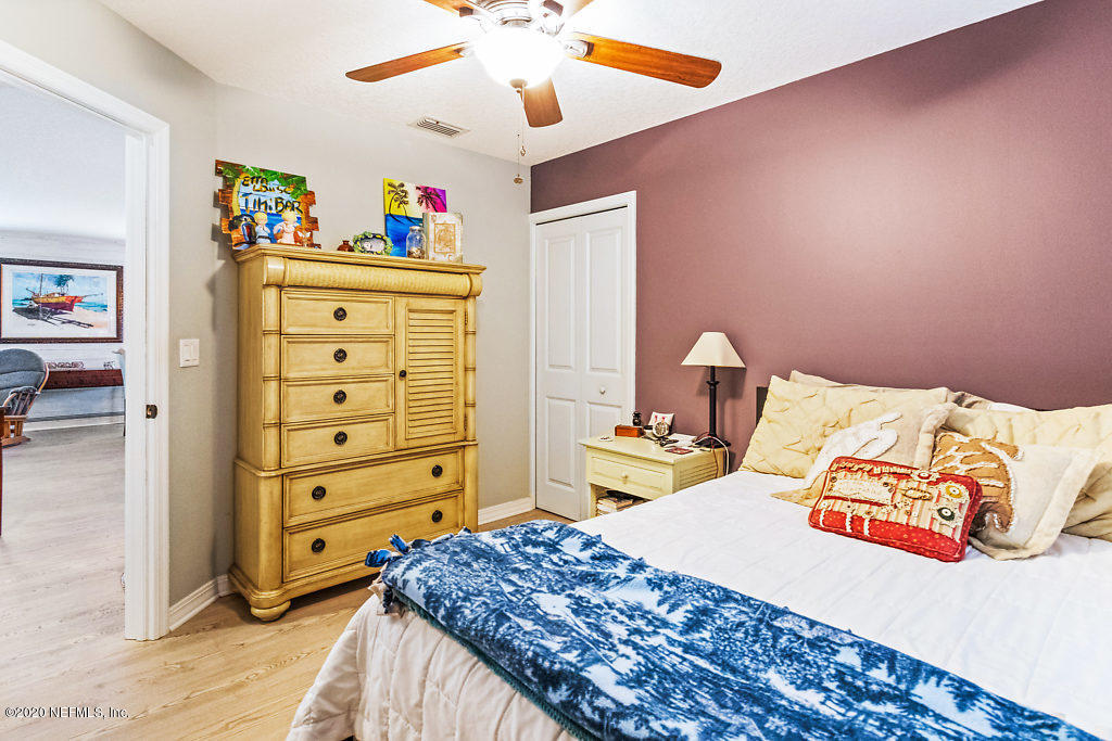 405 2nd Street St. Augustine, FL 32084 - Photo 18 of 49 a bedroom with a bed and a dresser
