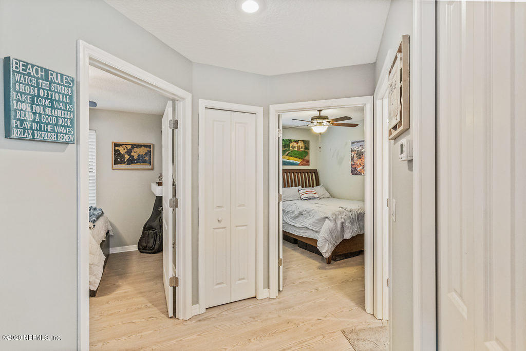 405 2nd Street St. Augustine, FL 32084 - Photo 20 of 49 a view of a bedroom with a bed and wooden floor