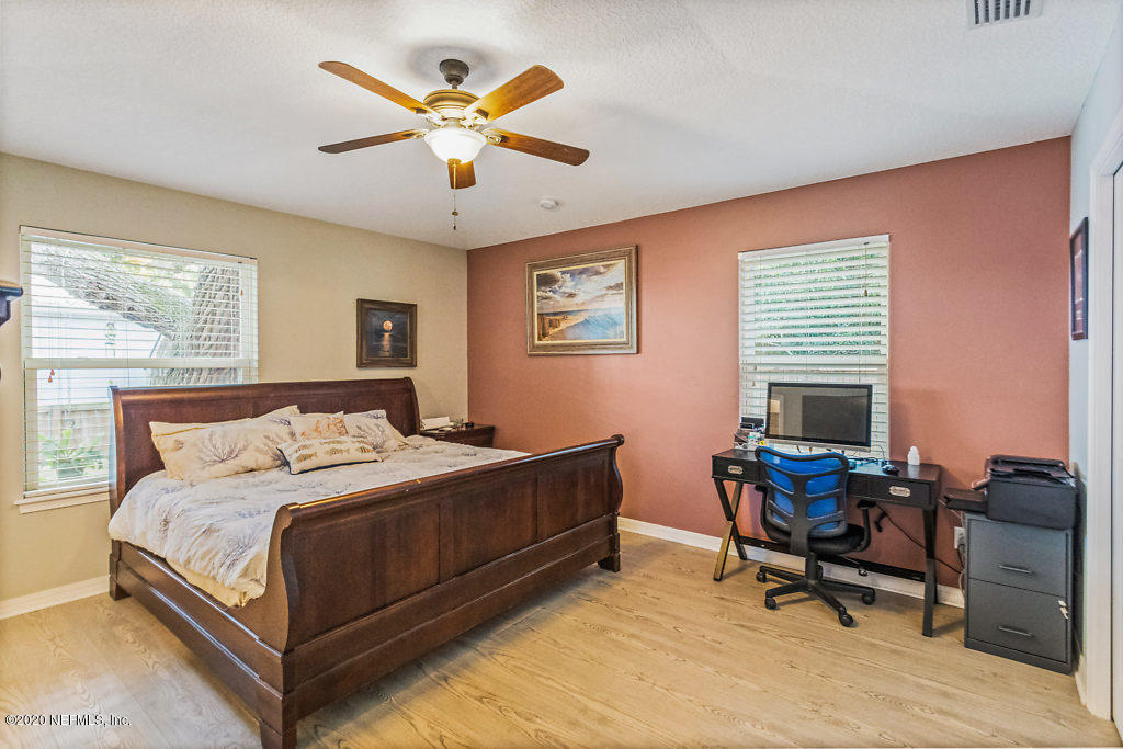 405 2nd Street St. Augustine, FL 32084 - Photo 21 of 49 a bedroom with a bed and a desk