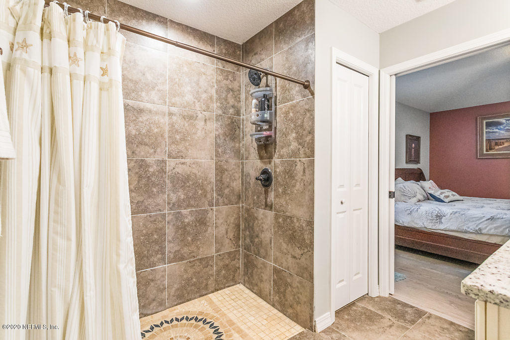 405 2nd Street St. Augustine, FL 32084 - Photo 23 of 49 a bathroom with a sink and a shower