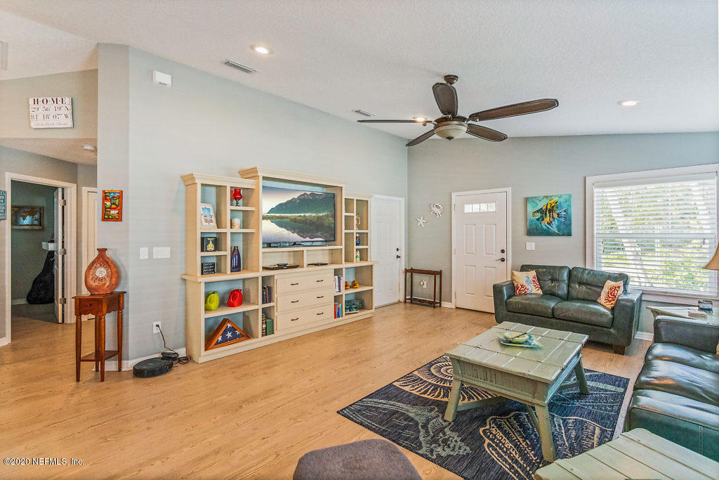 405 2nd Street St. Augustine, FL 32084 - Photo 26 of 49 a living room with furniture a ceiling fan and a window