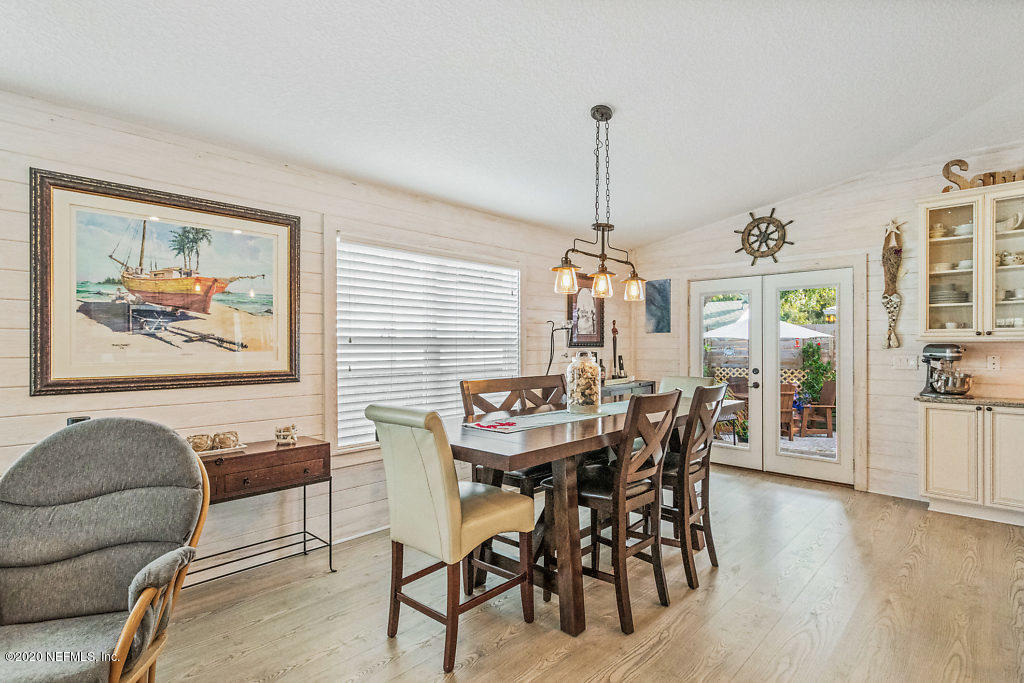 405 2nd Street St. Augustine, FL 32084 - Photo 30 of 49 a view of a dining room with furniture window and wooden floor