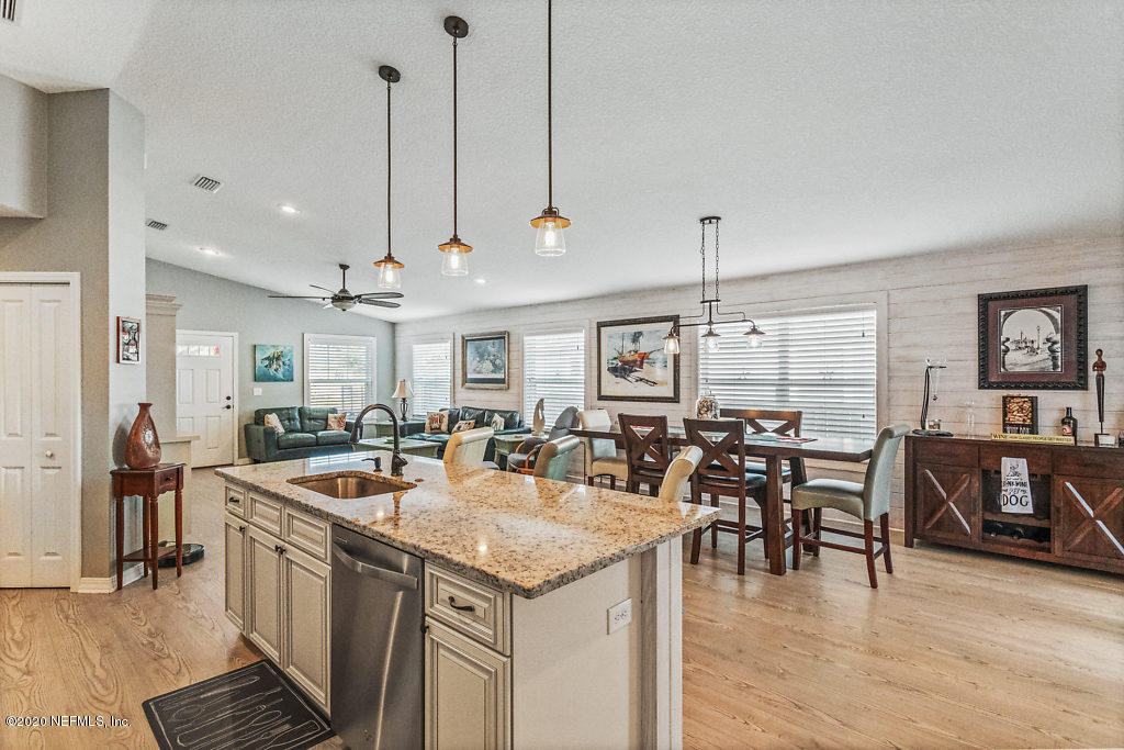 405 2nd Street St. Augustine, FL 32084 - Photo 32 of 49 a open kitchen with stainless steel appliances granite countertop a kitchen island a stove and a sink
