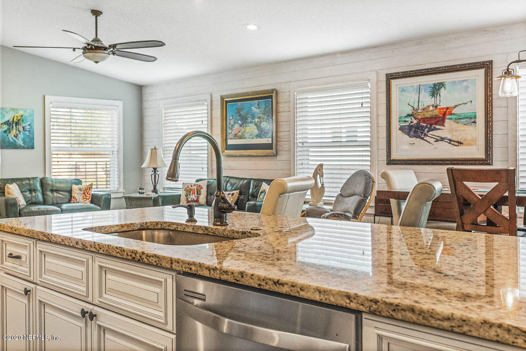 405 2nd Street St. Augustine, FL 32084 - Photo 33 of 49 a kitchen with a stove a sink and cabinets