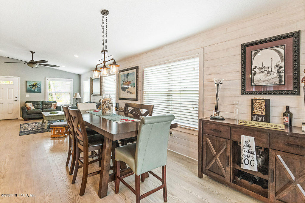 405 2nd Street St. Augustine, FL 32084 - Photo 34 of 49 a dining room with furniture a rug and wooden floor