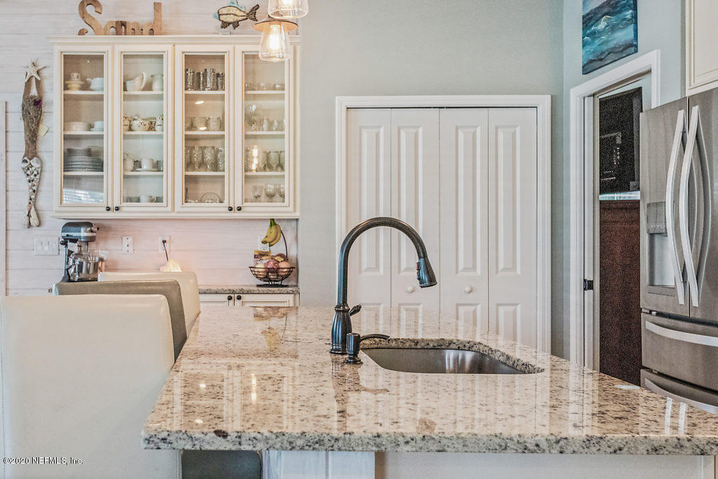 405 2nd Street St. Augustine, FL 32084 - Photo 38 of 49 a kitchen with cabinets and window