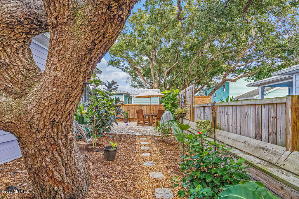 405 2nd Street St. Augustine, FL 32084 - Photo 41 of 49 a view of a yard with plants and large trees