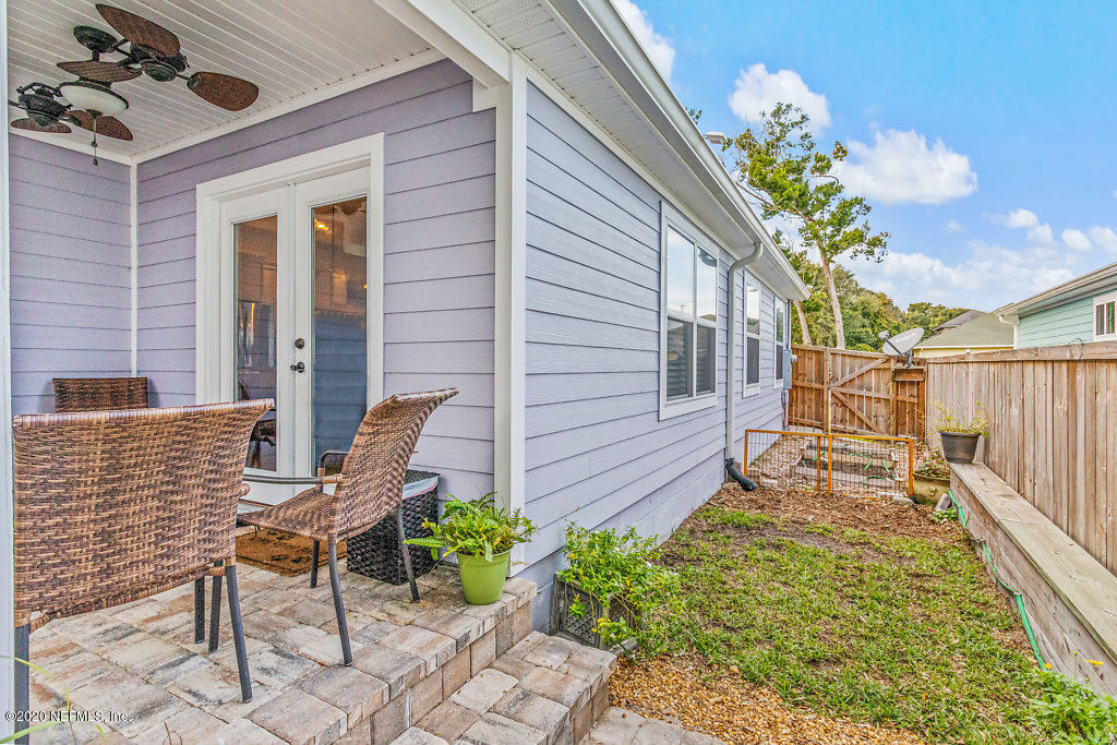 405 2nd Street St. Augustine, FL 32084 - Photo 45 of 49 a view of a chair and table in backyard of the house